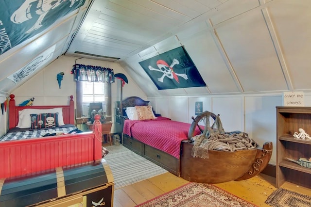 bedroom featuring vaulted ceiling and hardwood / wood-style floors