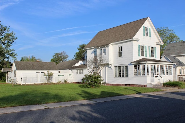 view of front of home with a front lawn