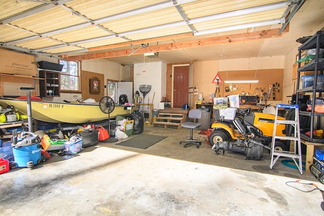 22170 Barnes Cir, Parksley, VA 23421 - garage featuring a garage door opener and a workshop area