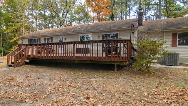 22170 Barnes Cir, Parksley, VA 23421 - rear view of house featuring central air condition unit, a chimney, and a deck