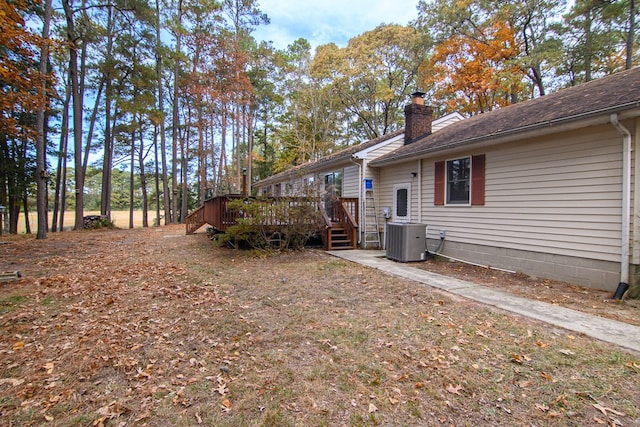22170 Barnes Cir, Parksley, VA 23421 - view of yard with a wooden deck and central AC