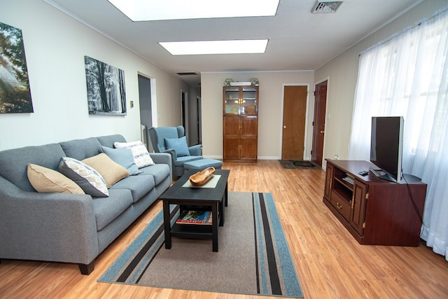 22170 Barnes Cir, Parksley, VA 23421 - living area with light wood finished floors and ornamental molding