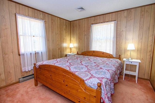 22170 Barnes Cir, Parksley, VA 23421 - bedroom with multiple windows, carpet floors, a baseboard heating unit, wood walls, and baseboards