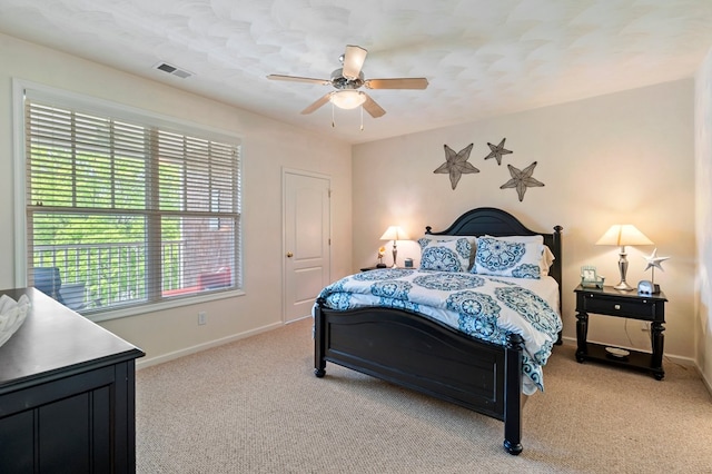 306 Troon Ct, Cape Charles, VA 23310 - bedroom with light colored carpet, baseboards, visible vents, and a ceiling fan