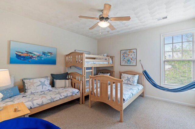306 Troon Ct, Cape Charles, VA 23310 - bedroom featuring visible vents, carpet flooring, baseboards, and ceiling fan