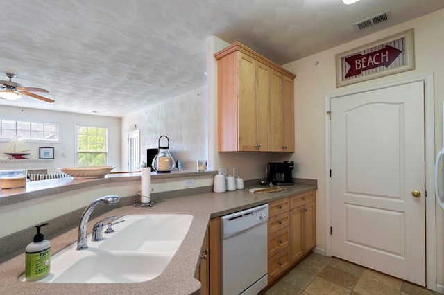 306 Troon Ct, Cape Charles, VA 23310 - kitchen featuring light brown cabinetry, a sink, dishwasher, a ceiling fan, and visible vents