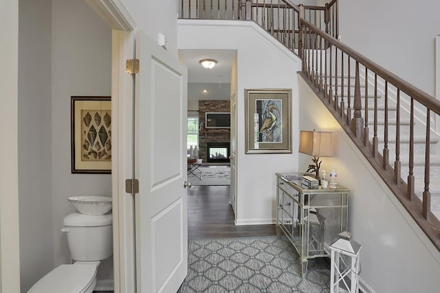 LOT884 Broadside Dr, Greenbackville, VA 23356 - stairs with baseboards, a multi sided fireplace, and wood finished floors