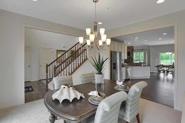 LOT884 Broadside Dr, Greenbackville, VA 23356 - dining area featuring a chandelier, recessed lighting, dark wood-type flooring, baseboards, and stairway