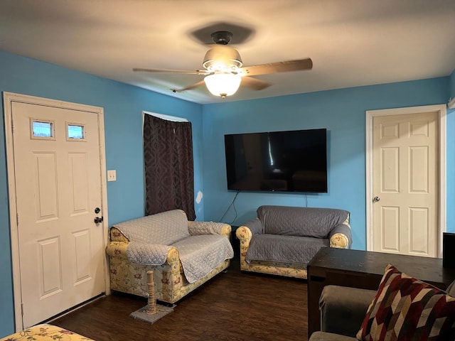 living room featuring dark hardwood / wood-style floors and ceiling fan