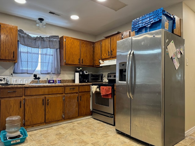 kitchen with sink and appliances with stainless steel finishes