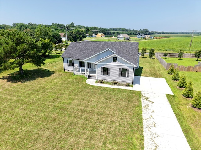 27212 Castle Row, Cape Charles, VA 23310 - view of front of property featuring covered porch, board and batten siding, a shingled roof, and driveway