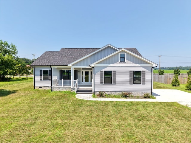 27212 Castle Row, Cape Charles, VA 23310 - view of front of property featuring a porch, a shingled roof, and crawl space