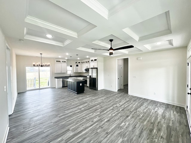 27212 Castle Row, Cape Charles, VA 23310 - unfurnished living room with dark wood-style flooring, coffered ceiling, crown molding, a ceiling fan, and a chandelier
