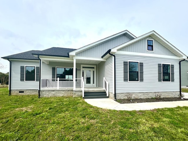 27212 Castle Row, Cape Charles, VA 23310 - view of front of house with a porch, a front yard, and board and batten siding