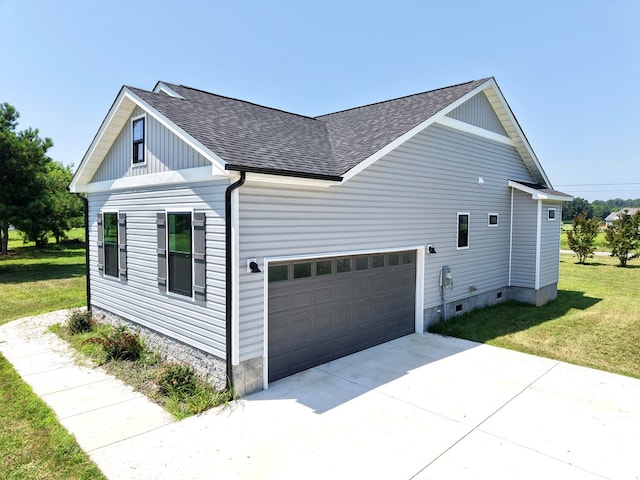 27212 Castle Row, Cape Charles, VA 23310 - view of home's exterior featuring roof with shingles, a lawn, a garage, and concrete driveway