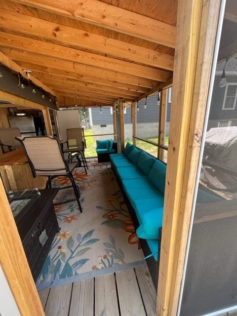 sunroom with lofted ceiling