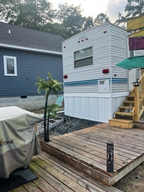 back of house featuring a deck