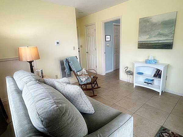 5061 Bay Colony Ln, Chincoteague, VA 23336 - living area with tile patterned flooring and baseboards