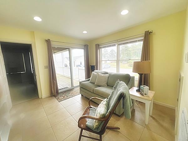 5061 Bay Colony Ln, Chincoteague, VA 23336 - living area with light tile patterned flooring, recessed lighting, and baseboards