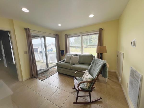 5061 Bay Colony Ln, Chincoteague, VA 23336 - living area with light tile patterned floors, recessed lighting, and baseboards
