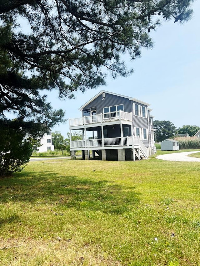 5061 Bay Colony Ln, Chincoteague, VA 23336 - back of property featuring a yard, a deck, and stairway