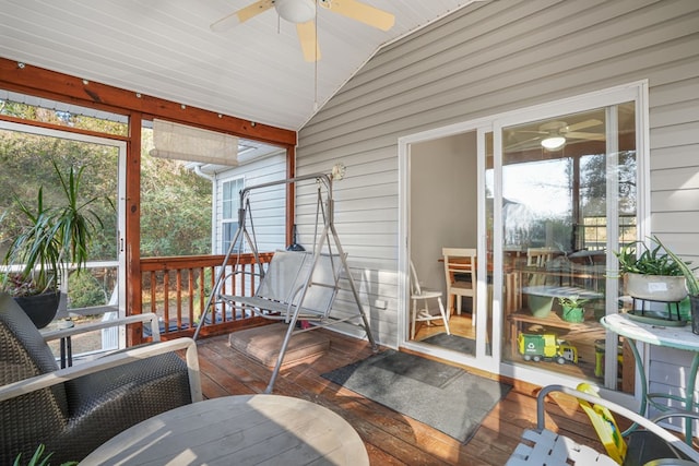 sunroom / solarium featuring lofted ceiling