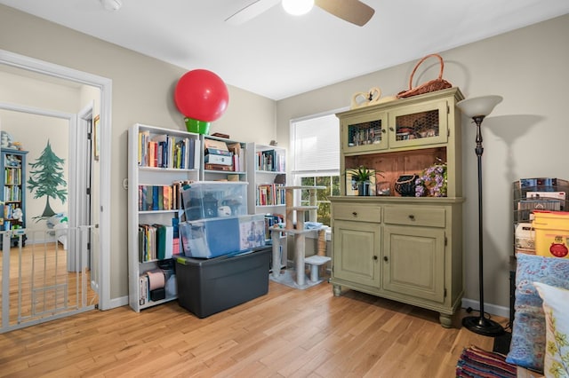 misc room featuring ceiling fan and light hardwood / wood-style flooring