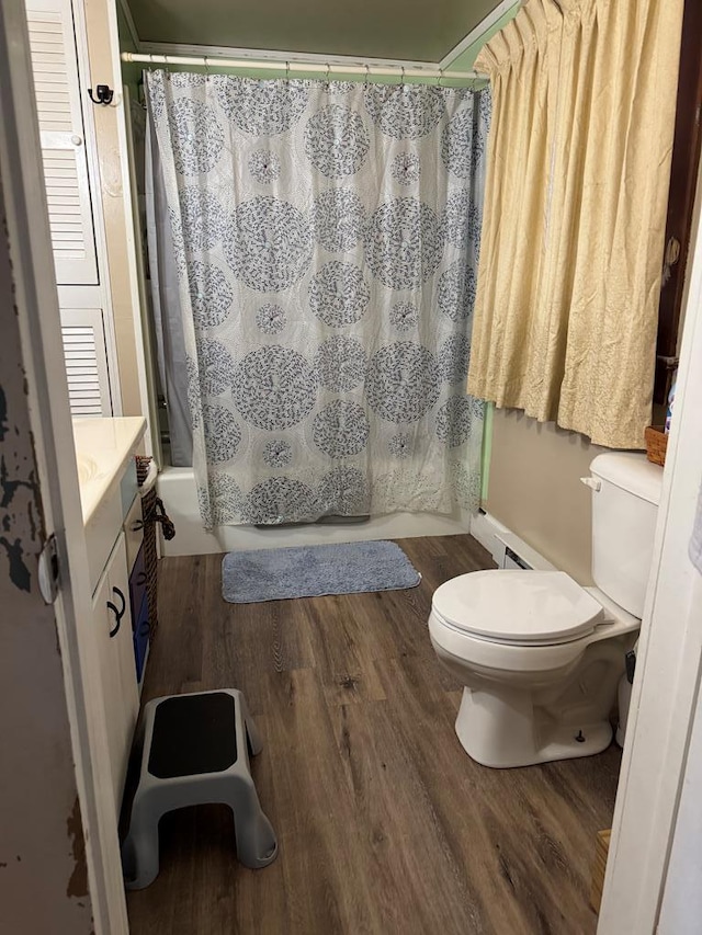 22338 Accomac Rd, Accomac, VA 23301 - full bath with toilet, wood finished floors, vanity, and shower / bathtub combination with curtain