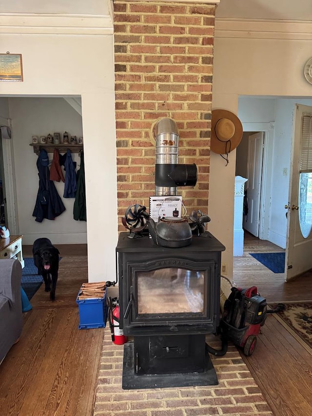 22338 Accomac Rd, Accomac, VA 23301 - detailed view of a wood stove, wood finished floors, and a fire extinguisher
