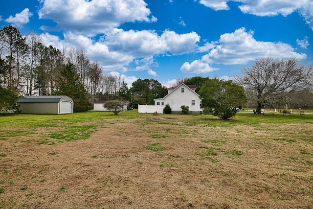 13091 Bethel Church Rd, Hallwood, VA 23359 - view of green lawn featuring an outbuilding and a garage