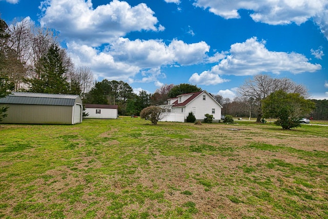 13091 Bethel Church Rd, Hallwood, VA 23359 - view of grassy yard featuring an outbuilding