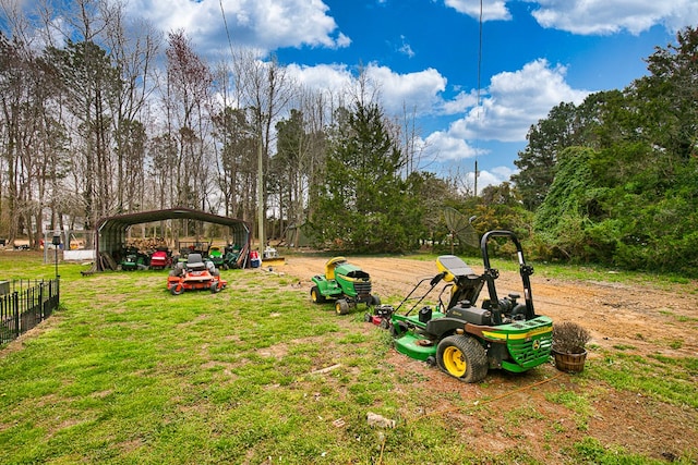 13091 Bethel Church Rd, Hallwood, VA 23359 - view of yard featuring a carport and view of wooded area
