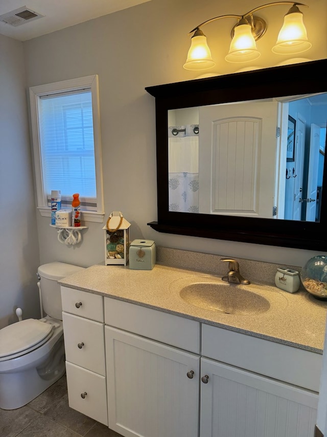 bathroom featuring vanity, a shower with curtain, and toilet