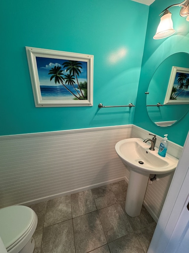 bathroom featuring sink and toilet