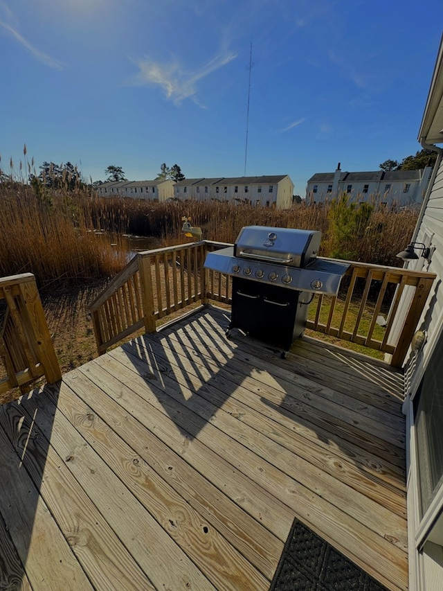 wooden deck with grilling area