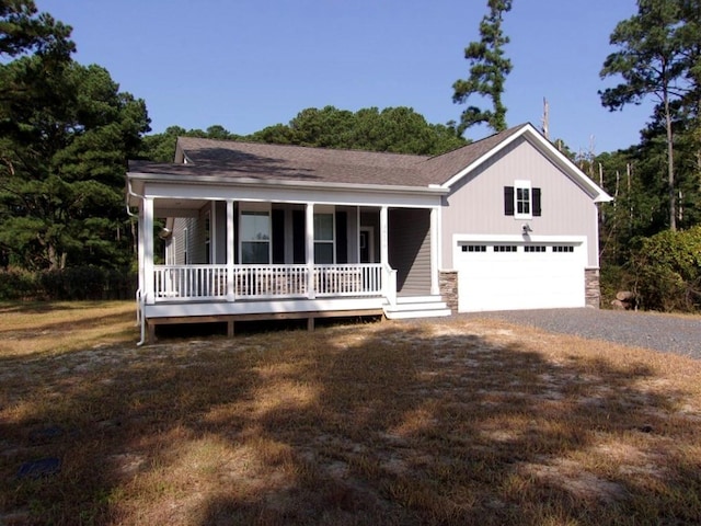 view of front of home with a porch and a garage