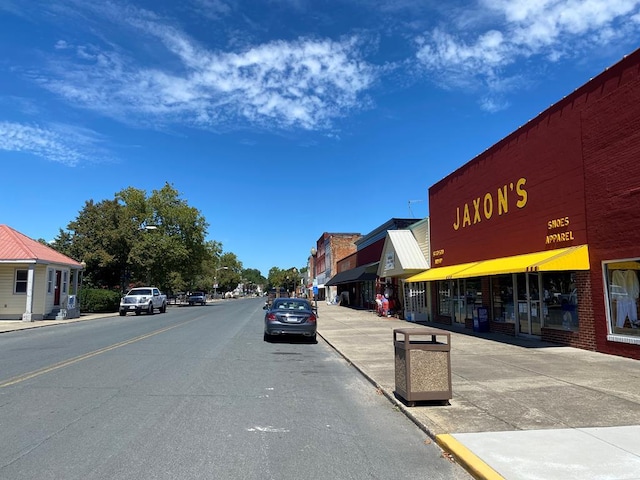 view of street with sidewalks and curbs