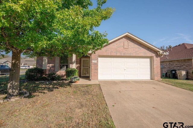 11017 Westhaven Cir, Flint, TX 75762 - view of front of house featuring brick siding, a garage, and concrete driveway
