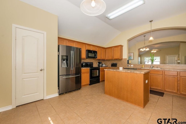 11017 Westhaven Cir, Flint, TX 75762 - kitchen with black appliances, lofted ceiling, arched walkways, light countertops, and light tile patterned floors