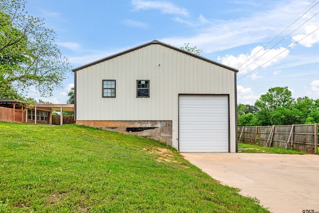 garage featuring a yard