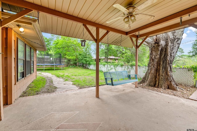 view of patio with a trampoline and ceiling fan