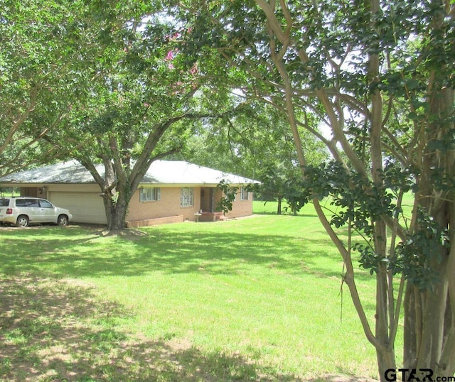 view of yard featuring a garage