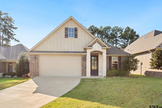 view of front of home featuring a garage and a front yard