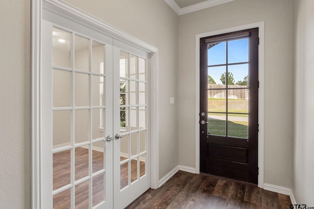 doorway featuring dark wood-type flooring, french doors, and ornamental molding