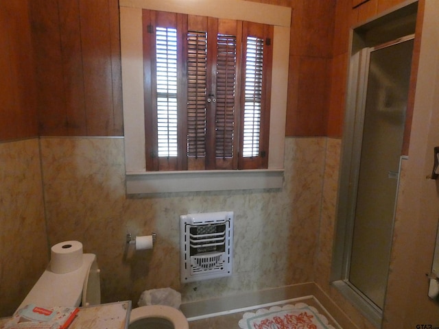 bathroom with toilet and heating unit