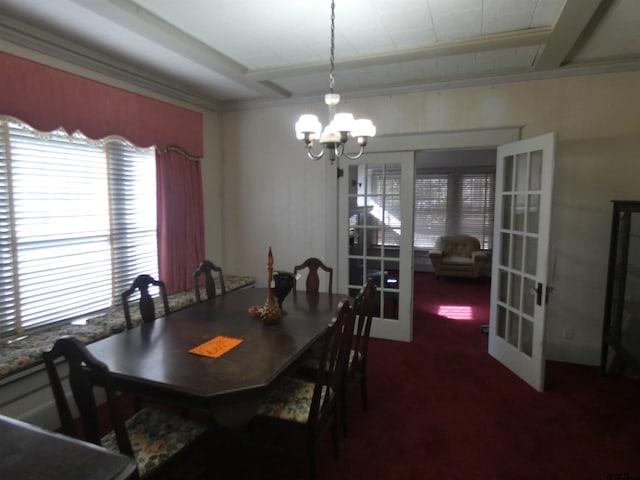 dining room featuring dark carpet and an inviting chandelier