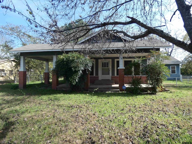 view of front facade with a porch and a front yard