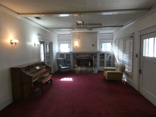 interior space with carpet floors, plenty of natural light, and ornamental molding