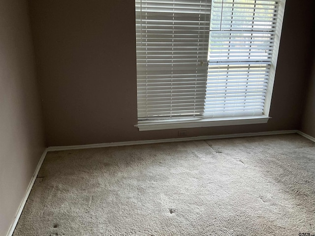 8307 Garrett Dr, Tyler, TX 75703 - carpeted empty room with baseboards