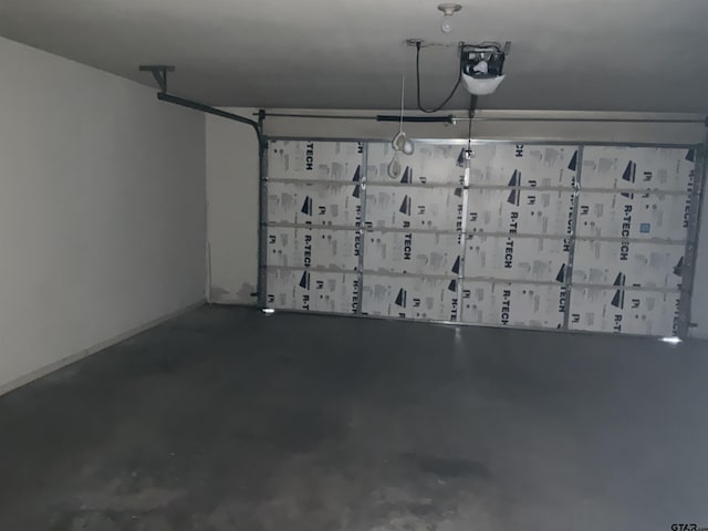8307 Garrett Dr, Tyler, TX 75703 - garage featuring a garage door opener